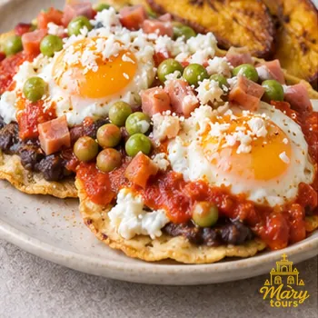 Huevos motuleños with beans, peas and tomato sauce